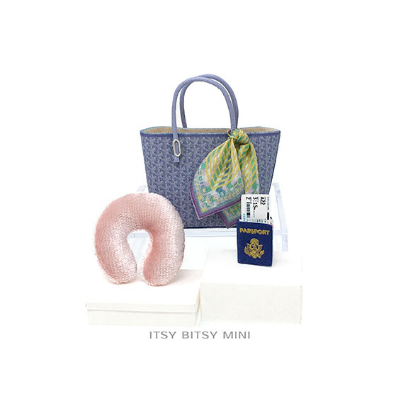 Periwinkle blue dollhouse miniature handbag with pink travel neck pillow and United States passport